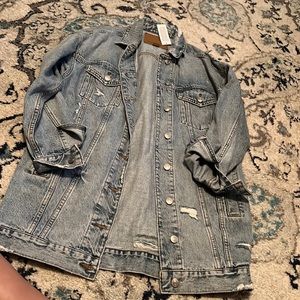 Distressed denim jacket